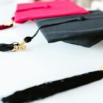 Graduation caps with tassels marked 2021, symbolizing academic achievement.
